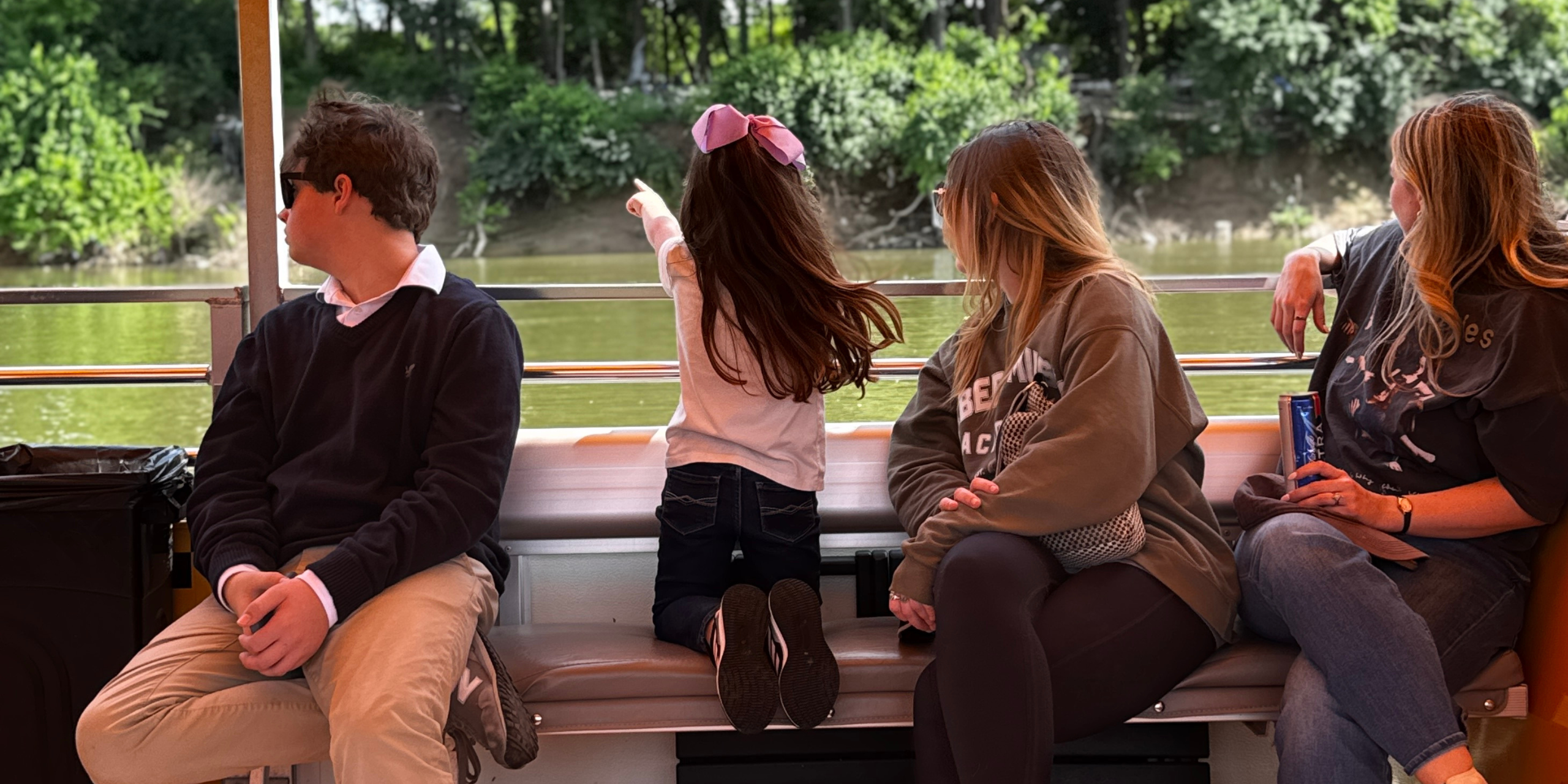 Family enjoying Nashville river cruise skyline views